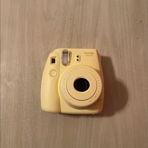 Yellow insta mini 8 polaroid camera